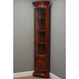 Tall narrow mahogany corner cabinet, bow front enclosed by curved glazed door, W52cm,