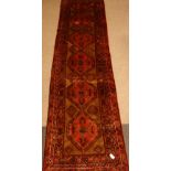 Large Persian Hamadan runner rug, with multiple lozenge, stylised motifs,