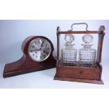 Early 20th century oak and silver-plated tantalus and a mahogany mantle clock (2)