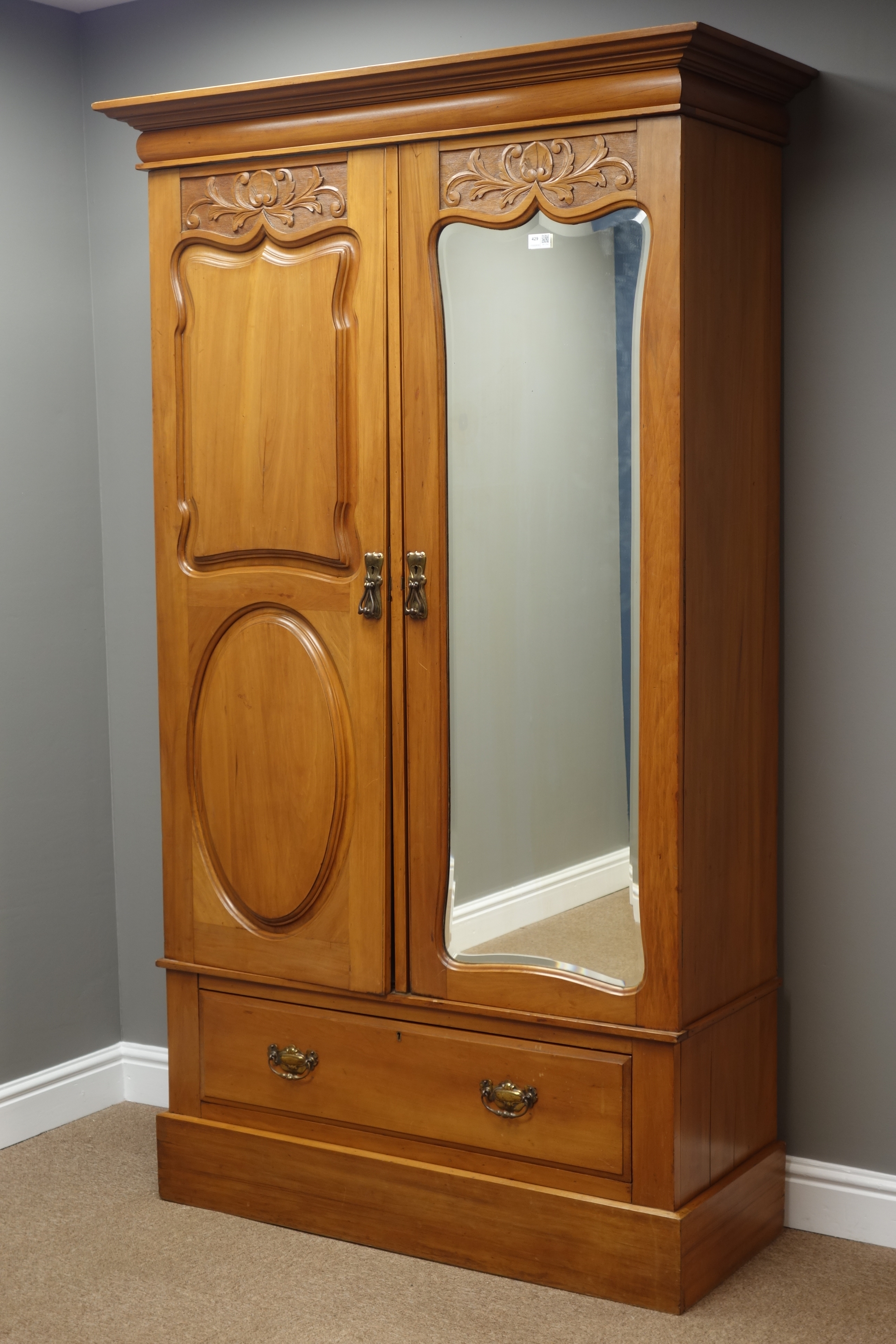 Edwardian walnut double wardrobe with shaped bevelled mirror door and drawer, W114cm, H194cm,