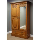 Edwardian walnut double wardrobe with shaped bevelled mirror door and drawer, W114cm, H194cm,