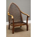 Early 20th century stained beech framed armchair, lancet shaped top with cane back,