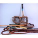 Three early 20th Century walking sticks with silver bands, two other walking sticks,