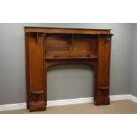 Large mahogany fire surround, reverse break front with arched aperture, raised shelves, W194cm,