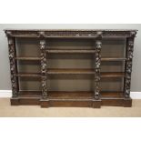 Victorian oak open bookcase, break front top with lunette moulding,
