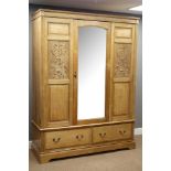Edwardian ash triple wardrobe, central bevelled mirror glazed door, relief carved panels,