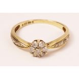 9ct gold diamond flower-head ring with diamond shoulders hallmarked Condition Report