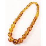 Single strand graduating circular amber bead necklace 56cm,