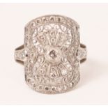 Diamond and platinum ring in open filigree setting with diamond shoulders stamped PL900 approx 7.