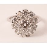 White gold and diamond cluster ring central diamond approx 0.