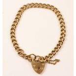 Gold curb chain bracelet hallmarked 9ct with hallmarked gold padlock approx 17.