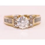 18ct gold ring set with brilliant cut diamond of approx 1 carat with baguette and round diamond