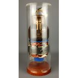 Large X-ray tube with motor in cylindrical case on mahogany base,