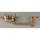 Small early 20th century brass & cast iron watchmakers lathe, approx 5in bed,