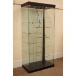 Glazed shops display cabinet, with circular five tier revolving display shelves,