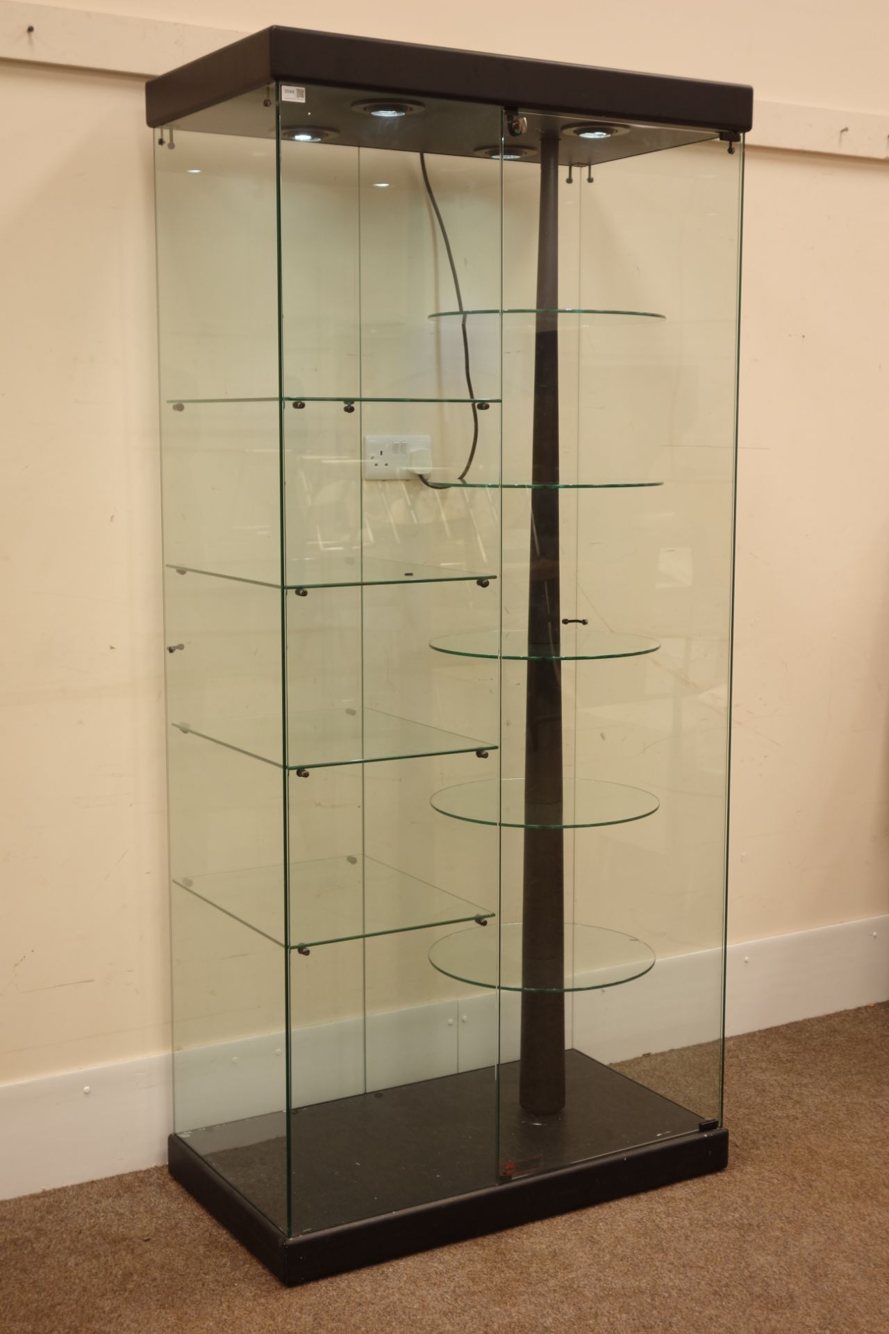 Glazed shops display cabinet, with circular five tier revolving display shelves,