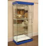Glazed floor standing shop display cabinet with mirrored back and illuminated interior,