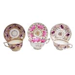 Early 19th century Derby cup and saucer decorated with stylized leaf motif in purple and gilt,