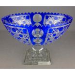 Large cut crystal bowl centrepiece with square footed base and blue overlay, W29.