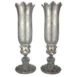 Pair of Baccarat crystal candle holders with etched decoration and spiralling base,