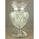 Large cut crystal footed vase with flared neck and star cut base,