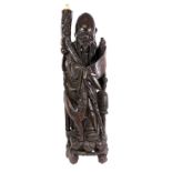 Early to mid 20th century Chinese root carving depicting an Immortal holding a staff and scroll,