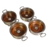 Pair of Georgian Sheffield-plated double decanter fruitwood coasters on rollers,