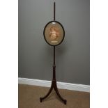 Late Victorian walnut pole screen, oval adjustable frame, fluted column with three splay legs,