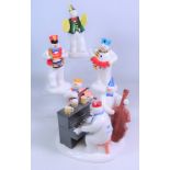 Four Coalport The Snowman musical figurines; 'The Band Plays on', 'Crash went the Cymbals',