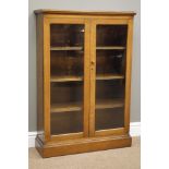 Medium oak bookcase, enclosed by two glazed doors, plinth base, W73cm, H105cm,