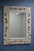 Rectangular wall mirror in ornate painted frame,