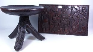 African tribal hardwood stool with three carved flared legs,
