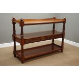 Victorian mahogany three tier buffet, turned and fluted supports, two drawers, W137cm, H101cm,