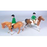 Beswick model of a Palomino pony with a green jacketed horse rider and a Beswick Skewbald Pony with