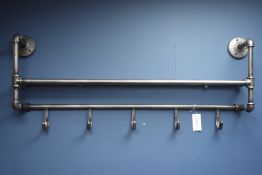 Industrial style metal tubular wall rack with coat hooks,