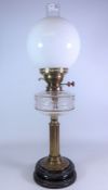 Victorian brass oil lamp, with black glazed base,