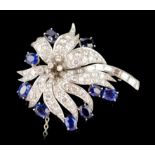 Oval sapphire and round diamond en tremblent platinum set spray brooch with baguette diamond stem