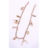 Rose gold watch chain stamped 9ct with seven 9ct charms, 18ct pitcher charm stamped 750,