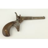 Late 19th century steel single shot Pistol, stamped with a crowned U, walnut grip,