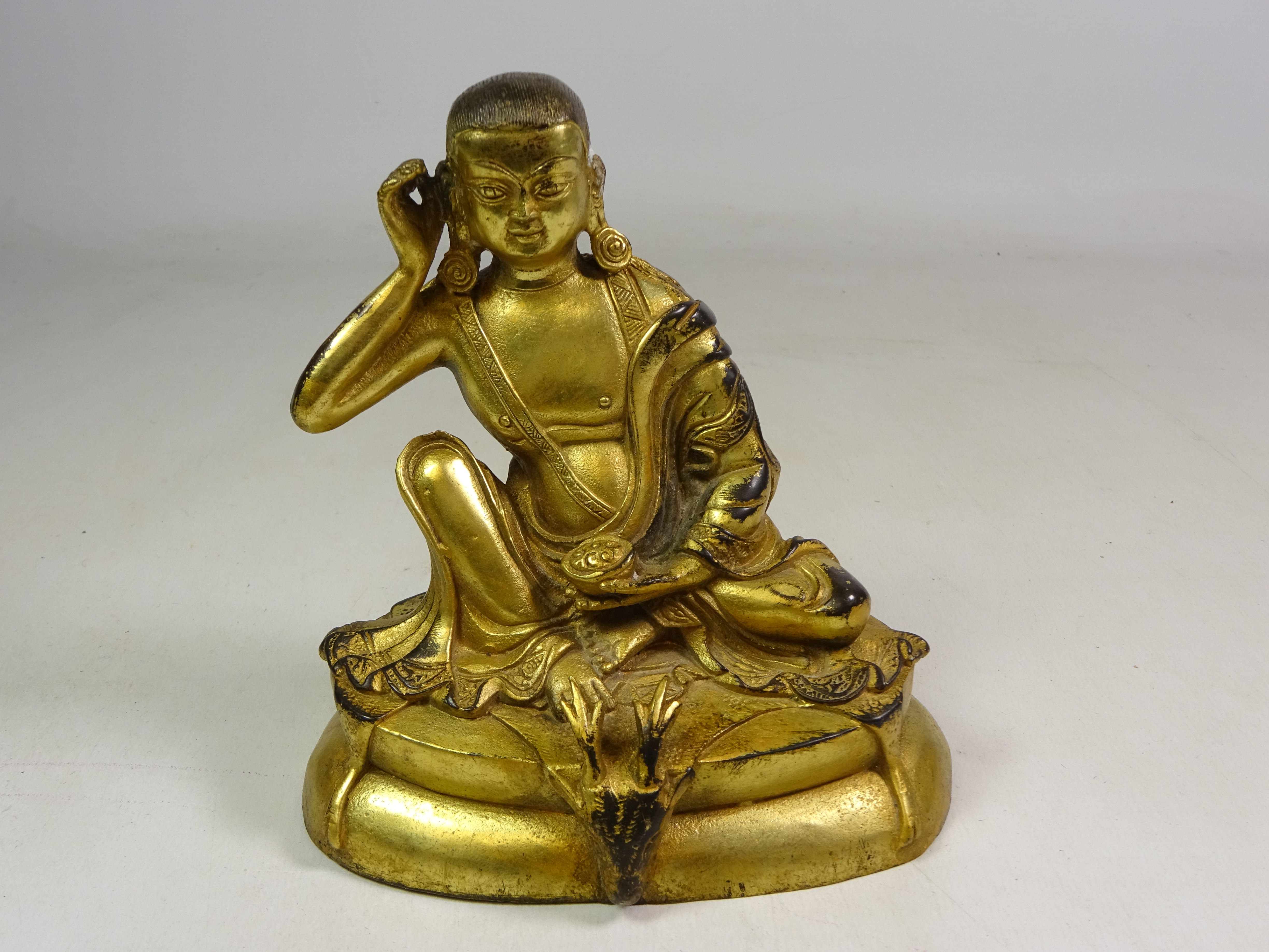 Late 19th century Tibetan gilt bronze figure of Jetsun Milarepa,