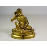 Late 19th century Tibetan gilt bronze figure of Jetsun Milarepa,