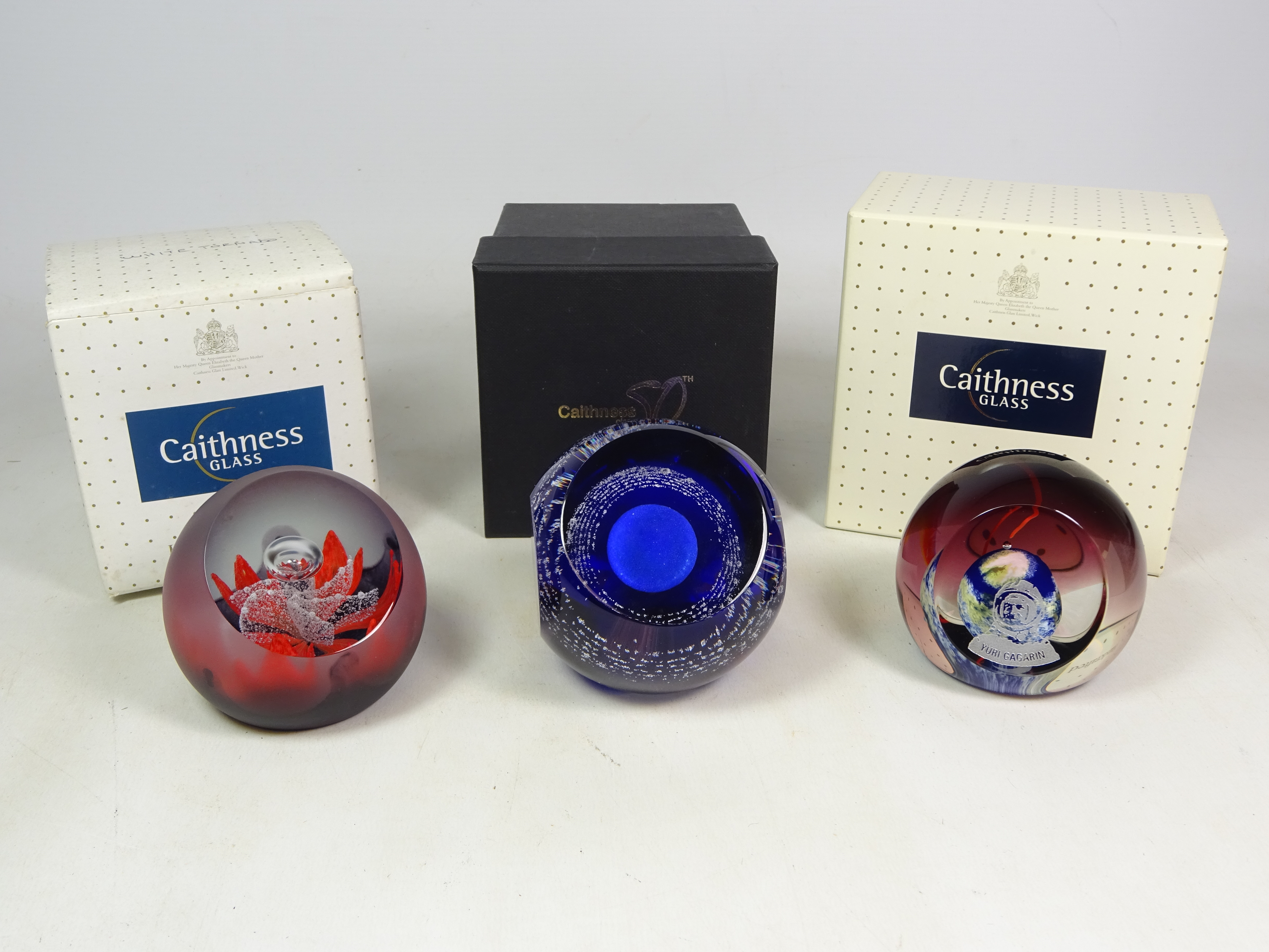 Three Caithness limited edition paperweights; 'Yuri Gagarin' 13/100,