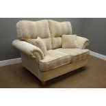 Two seat sofa upholstered in beige natural fabric,