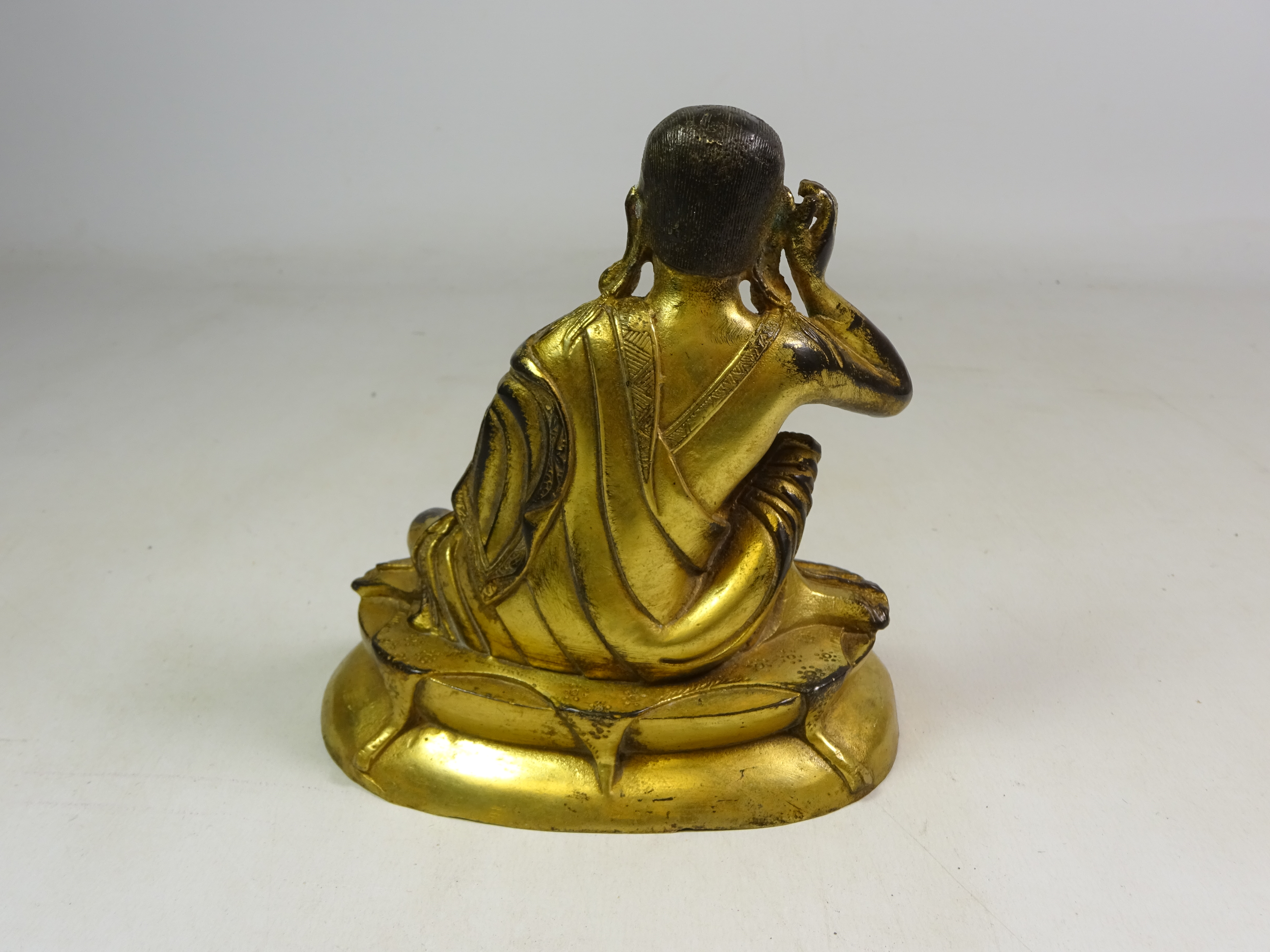 Late 19th century Tibetan gilt bronze figure of Jetsun Milarepa, - Image 2 of 3