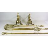 Pair of 19th century cast bras fire dogs and a three piece brass companion set (5)