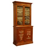 Edwardian walnut bookcase on cupboard, two glazed doors above panelled double cupboard,