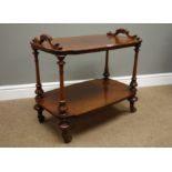 Victorian mahogany two tier what not, carved handles, turned supports and feet with castors,