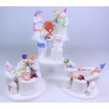 Four Coalport The Snowman figurines; 'At The Party', 'The Merry Trio',