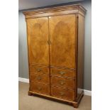 Georgian style figured mahogany double wardrobe, enclosed by two doors with simulated drawers,