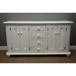 White painted dresser base with rounded front corners, four drawer and two double cupboards,